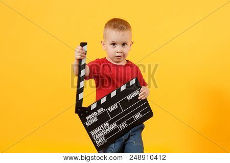 Little Cute Kid Baby Boy 3-4 Years Old In Red T-shirt Holding In Hand Classik Black Film Making Clap