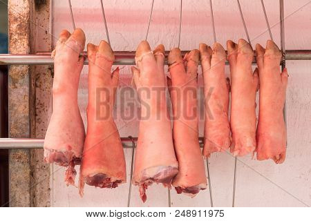 Pigs Trotters Feet Hanging In Butcher Shop