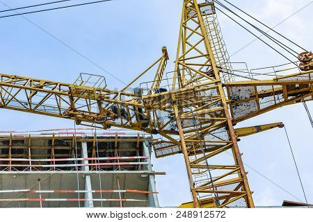 Construction Site With Cranes And Building With Blue Sky Background