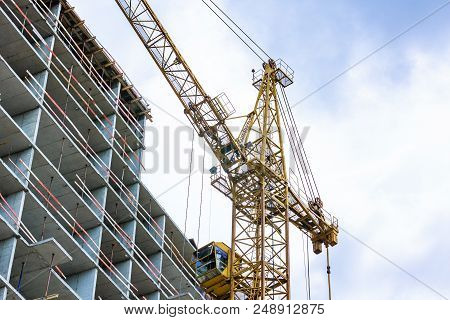 Construction Site With Cranes And Building With Blue Sky Background