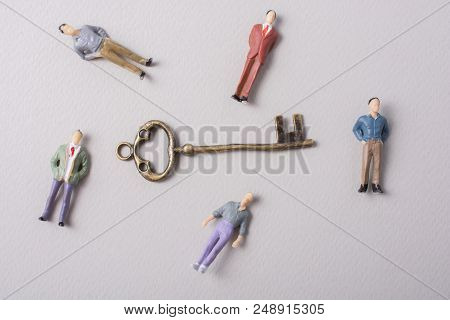 Tiny Figurine Of Man Miniature And Retro Key