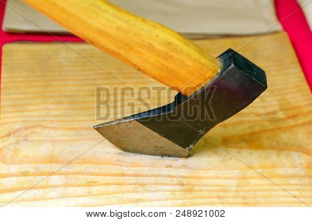 Ax On A Wooden Background, Top View