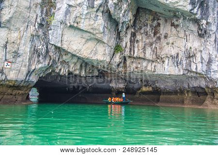 Halong, Vietnam - June 17, 2018: Tourists Exploring Cave In Halon Bay, Vietnam In A Summer Day