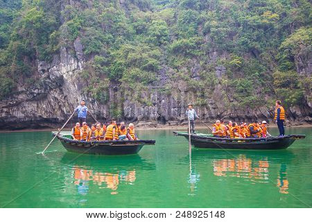 Halong, Vietnam - June 17, 2018: Tourists In Boats In Halon Bay, Vietnam In A Summer Day