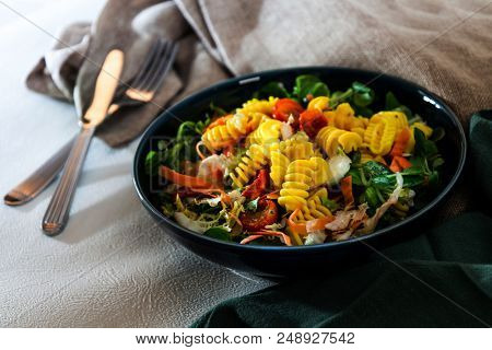 Salad made from radiatori cooked pasta, goat cheese and oil vinaigrette