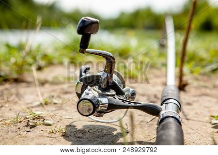 Fisherman's Reel, Mounted On A Fishing Rod. Feeder Fishing In English Style
