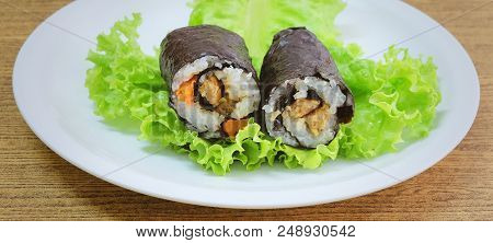 Japanese Cuisine, Traditional Vagetarian Japanese Rice Maki Sushi Roll Stuff With Tofu And Carrot Wr