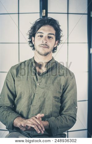 Edan Handsome Young Man, 20y, Is Posing In Studio With Crossed Hands At Chest With Satisf Expression