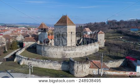 The Calnic Fortress On The Hills Over Calnic Village. Transylvania, Romania