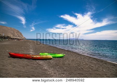 Permissa black sand beach in Santorini. Greece. 
