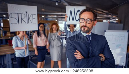 Unsatisfied Employees On Strike In The Office, Director Standing With His Back To Employees. Modern 