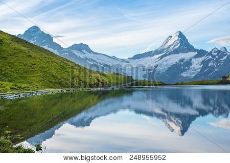 A Magical Landscape With A Lake In The Mountains In The Swiss Alps, Europe. Wetterhorn, Schreckhorn,