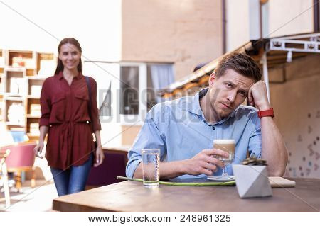 Wait For Girlfriend. Handsome Fashionable Man Feeling A Little Bit Tired While Waiting For His Girlf