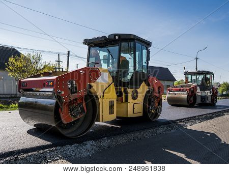 Heavy Vibration Roller At Asphalt Pavement Working On The New Road Construction Site. Repairing