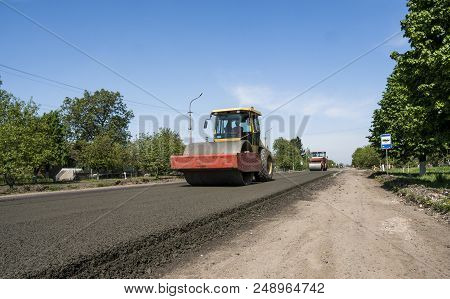 Heavy Vibration Roller At Asphalt Pavement Working On The New Road Construction Site. Repairing