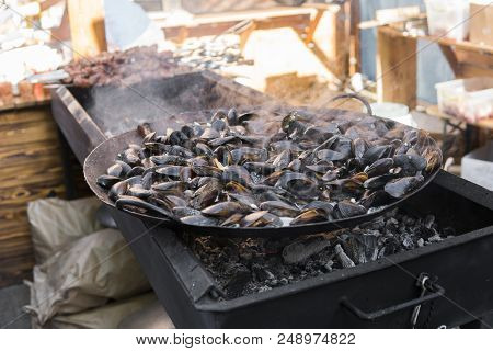 Fresh Mussels At Grill Pan. Seafood Barbecue Outdoors. Picnic Healthy Food, Mussels In Shells. Plent
