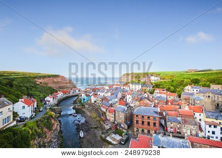 The Fishing Village Of Staithes In North Yorkshire, England, In The Evening.