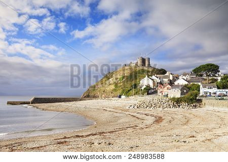 The Town And Castle Of Criccieth, North Wales, On A Bright Summer Day With Clearing Weather.