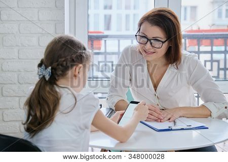Girl At Meeting With Psychologist Showing His Social Page On Smartphone, Talking Psychiatrist And Ch