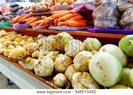 Many Different Vegetables Are Sold On The Market, Such As Celery, Turnips, Carrots, Onions, Radishes