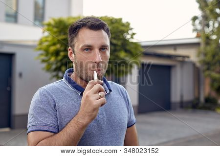 Electronic Cigarettes, Cigarette Technology. Tobacco Iqos System. Close-up Of A Man Smoking An Elect