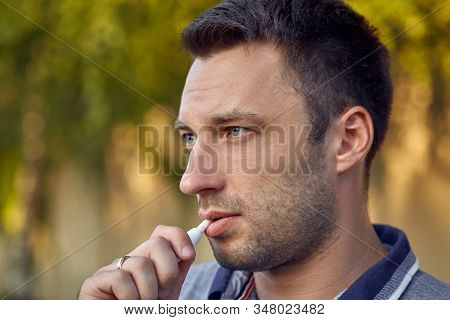 Electronic Cigarettes, Cigarette Technology. Tobacco Iqos System. Close-up Of A Man Smoking An Elect