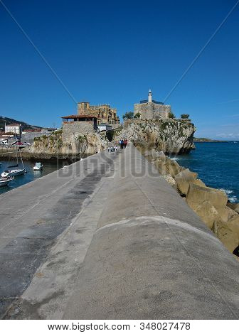 People Walking At The Port In Castro Urdiales, Spain