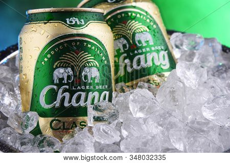 Two Cans Of Chang Beer In Bucket With Crushed Ice