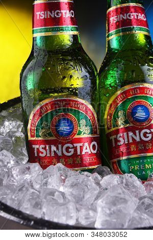 Two Bottles Of Tsingtao Beer In Bucket With Crushed Ice