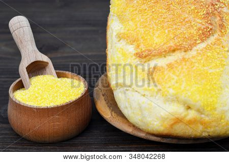 Cornmeal And Corn Bread On Wooden Background