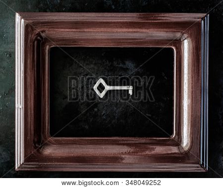 Door Key In The Frame. Real Estate Concept.metal Lock Pick. Key As A Symbol Of Power.