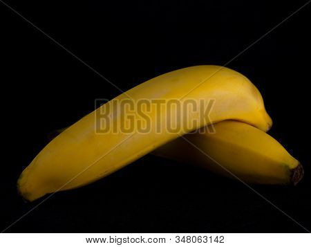 Fresh Cavendish Banana On Black Background. (fruit For Health)