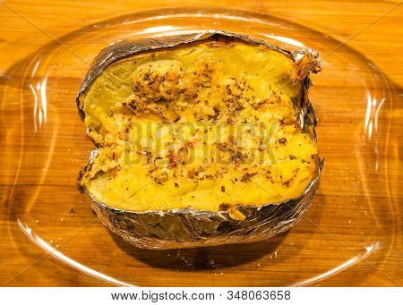 Homemade Baked Potatoe In Foil, Selective Focus.