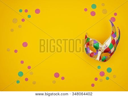 Festive, Colorful Mardi Gras Or Carnivale Mask And Accessories Over Yellow Background. Party Invitat