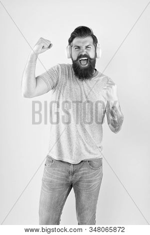 Hipster Happy Using Modern Wireless Headphones. Bearded Man Listen Music Wireless Gadget. Wireless H