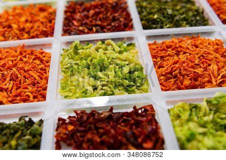 Sublimated Thinly Sliced Vegetables. Dried Cabbage. Dry Carrots And Beets Are Strewn In Neighboring 