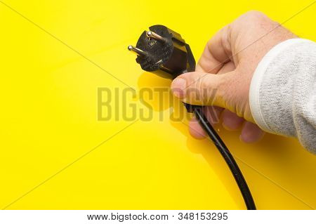 Black Plug On Colored Background