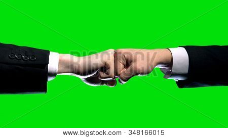 Business Interests Conflict Fists On Green Screen Background, Market Competition