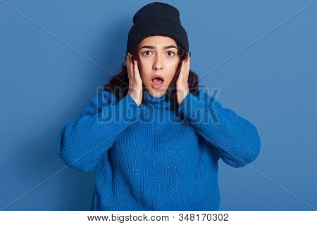 Image Of Surprised Impressed Black Haired Female Opening Mouth And Eyes Widely, Raising Arms, Having