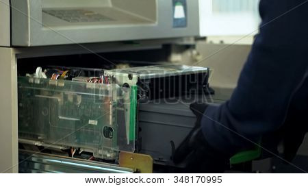 Maintenance Worker Inserting Cases With Cash In Atm, Authorized Access, Service