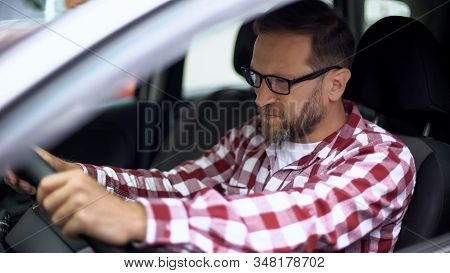 Tired Man Sitting In Car Suffering Neck Discomfort, Spinal Problem, Cervicalgia