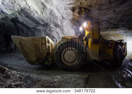 LHD load haul dumper machine toro truck in gold mine underground tunnel