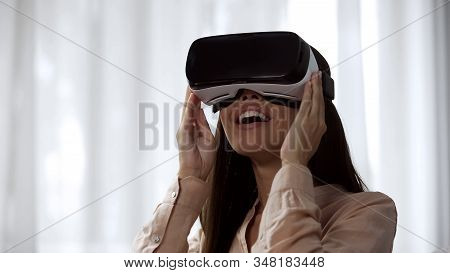 Surprised Female Playing Video Game In Virtual Reality, Spinning Head In Vr
