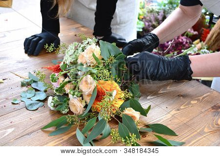 Female Florist Create A Bouquet At Workplace. Floristics Workshop. Flowers Delivery, Creating Order.