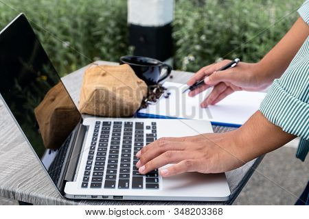 The Woman Inspected The Coffee Bean Quality And Recorded The Results.