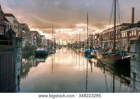 Photo Of The Historic Delfshaven With Beautiful Colored Clouds In Rotterdam, And Is The Birthplace O