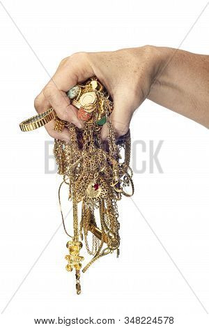 Hand Holding Tangled Mess Of Jewelry