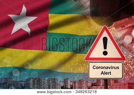 Togo Flag And Coronavirus 2019-ncov Alert Sign. Concept Of High Probability Of Novel Coronavirus Out