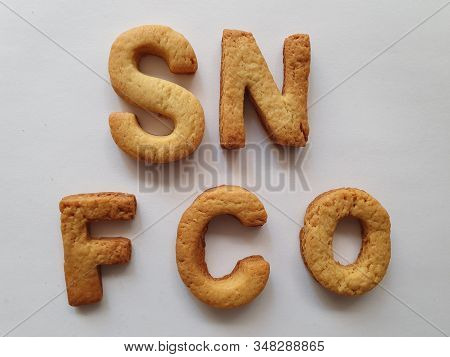 Baked Biscuits With Shape Of Letters Forming The Text Sn Fco
