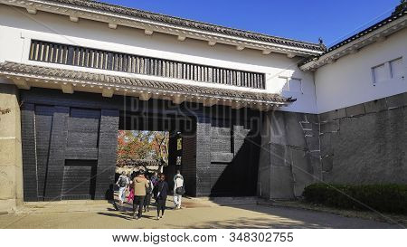 Osaka, Japan- 01 Dec, 2019: The Ornate Black And White Otemon Entrance Gate Of Osaka Castle.